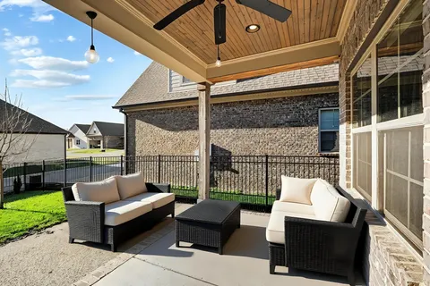 a view of a entrance gate of a house with a garden