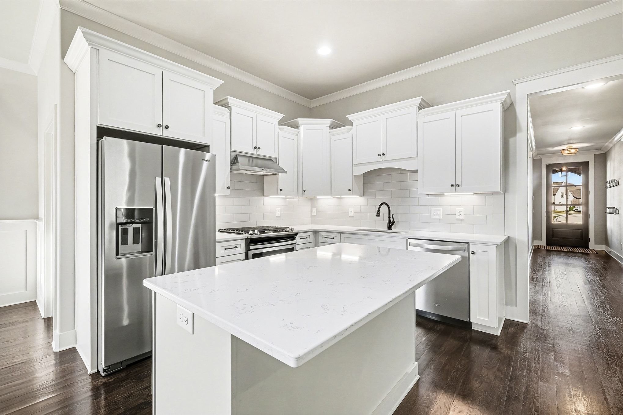 3008 Turnstone Trace Spring Hill, TN 37174 - Photo 6 of 30 a kitchen with white cabinets and stainless steel appliances