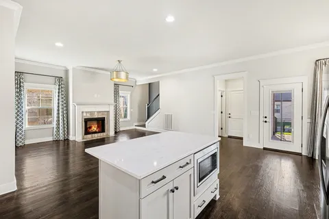 a kitchen with a sink and a fireplace