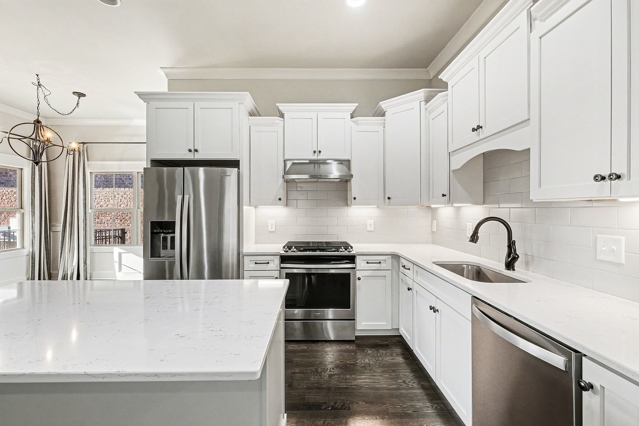 3008 Turnstone Trace Spring Hill, TN 37174 - Photo 8 of 30 a kitchen with stainless steel appliances granite countertop a sink stove and refrigerator
