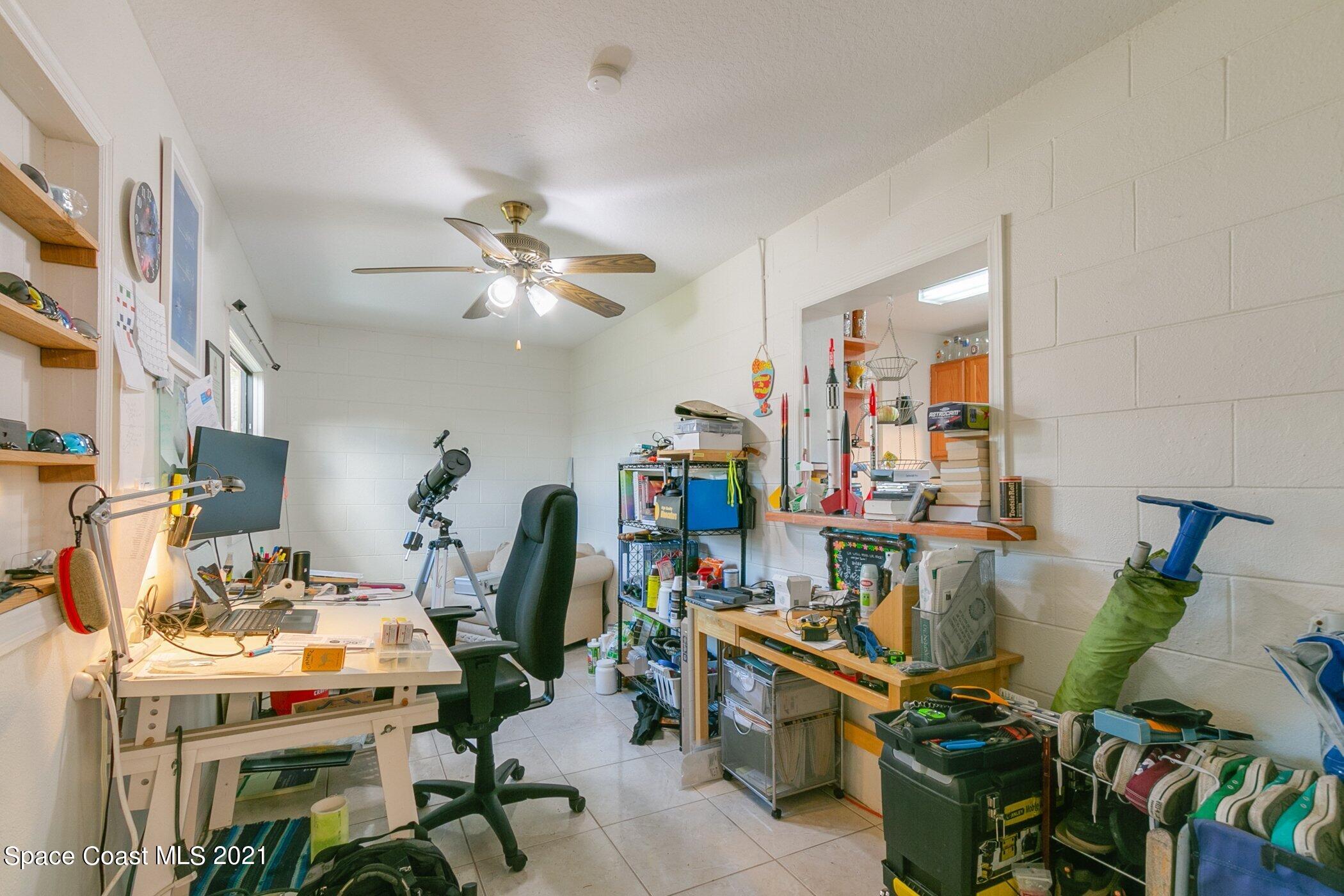 3222 Lipscomb Street Melbourne, FL 32901 - Photo 13 of 27 a view of a workspace with furniture
