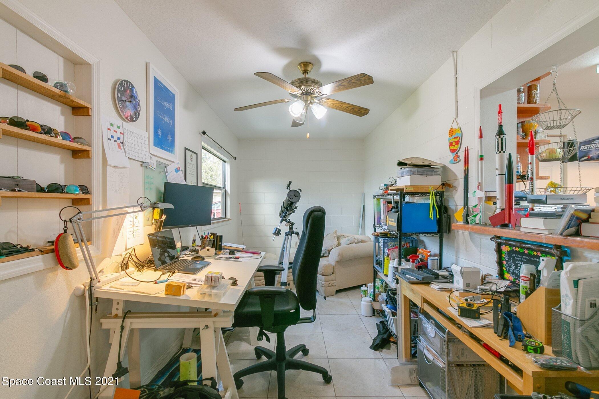 3222 Lipscomb Street Melbourne, FL 32901 - Photo 14 of 27 a view of a workspace with furniture