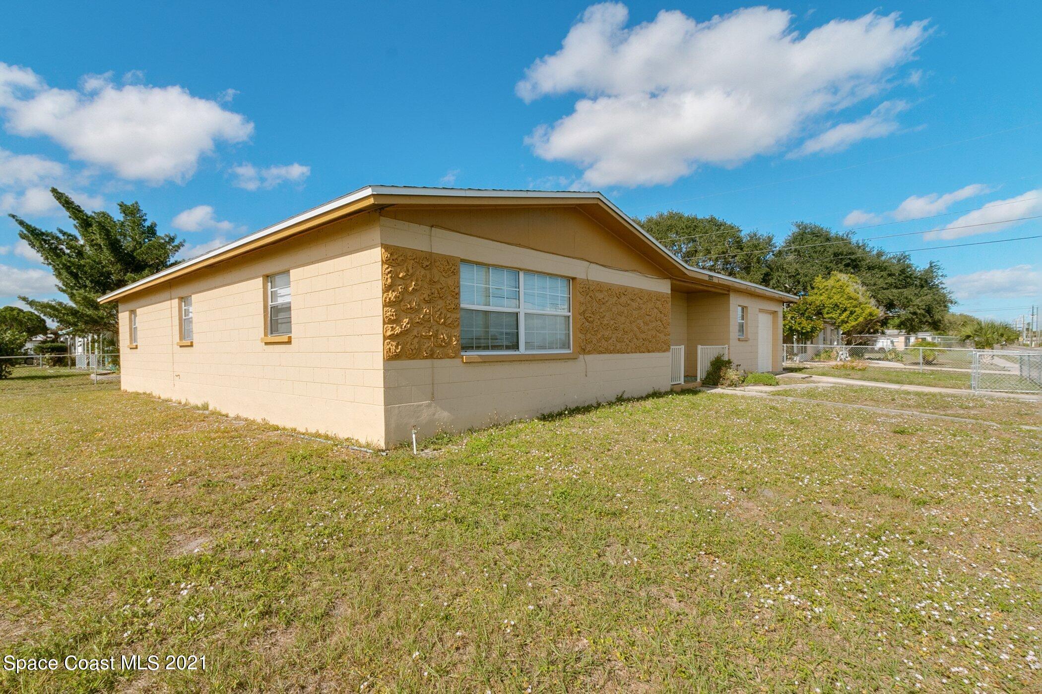 3222 Lipscomb Street Melbourne, FL 32901 - Photo 2 of 27 a view of a house with backyard and garden