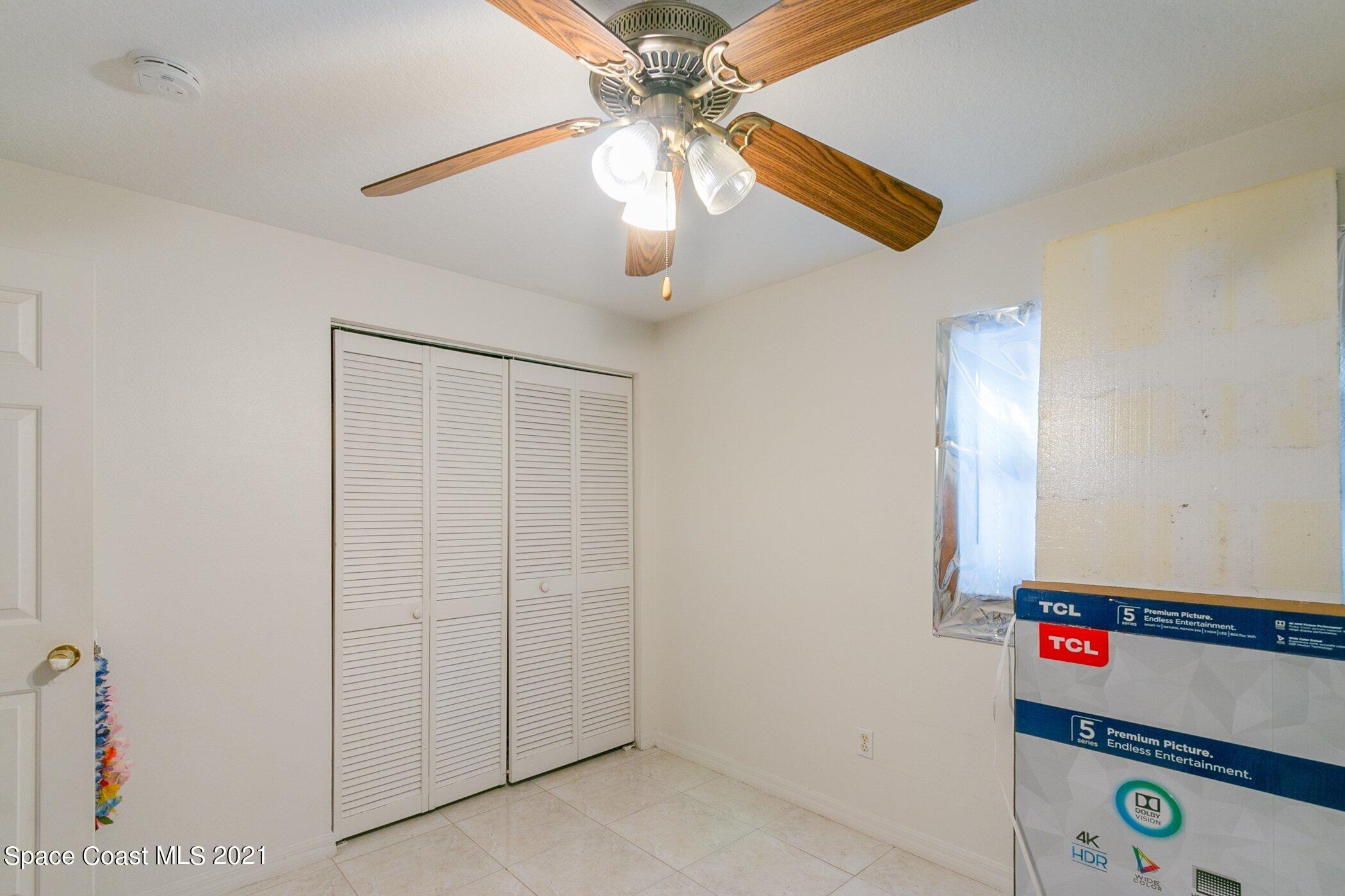 3222 Lipscomb Street Melbourne, FL 32901 - Photo 21 of 27 a room with window and ceiling fan