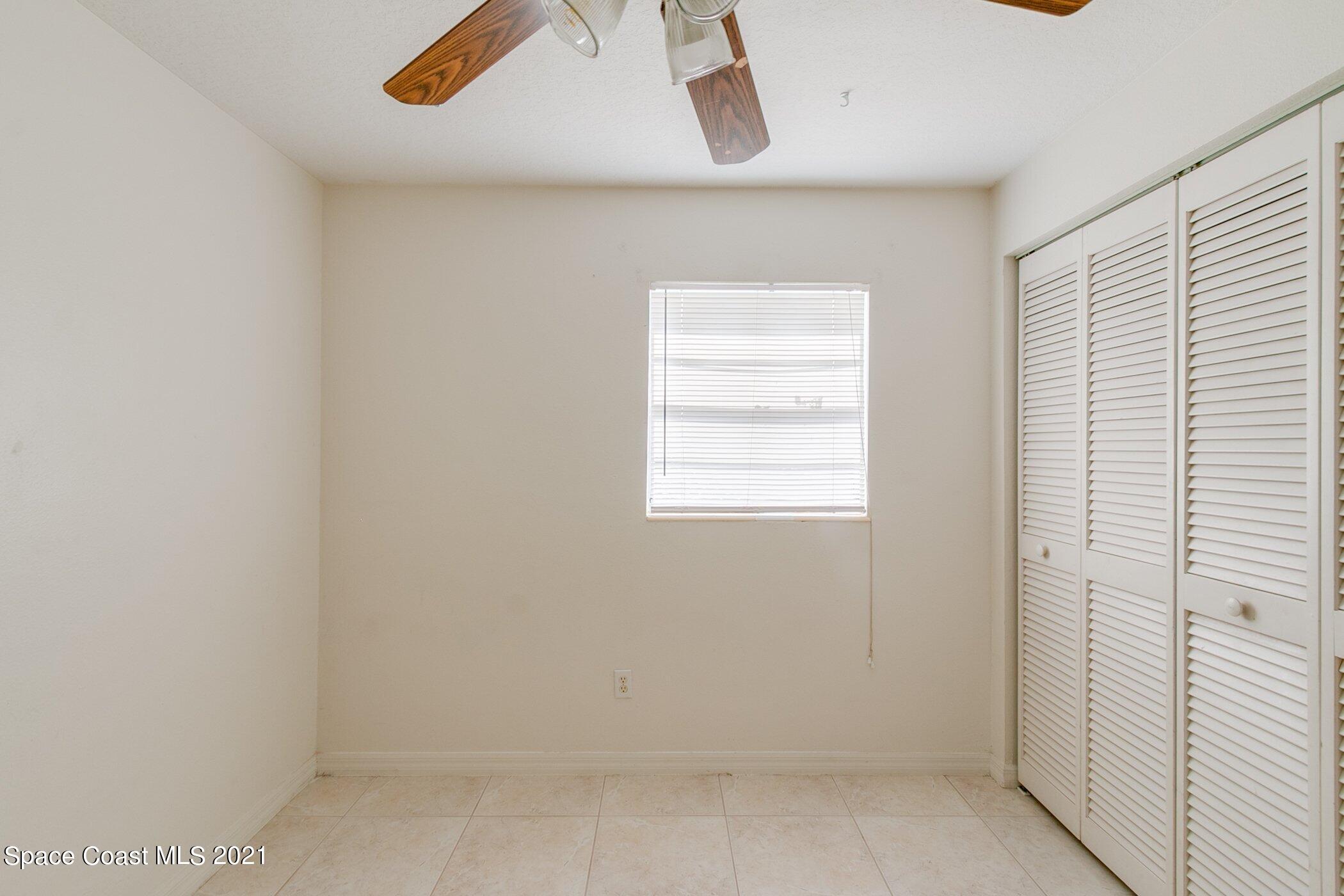 3222 Lipscomb Street Melbourne, FL 32901 - Photo 23 of 27 an empty room with windows