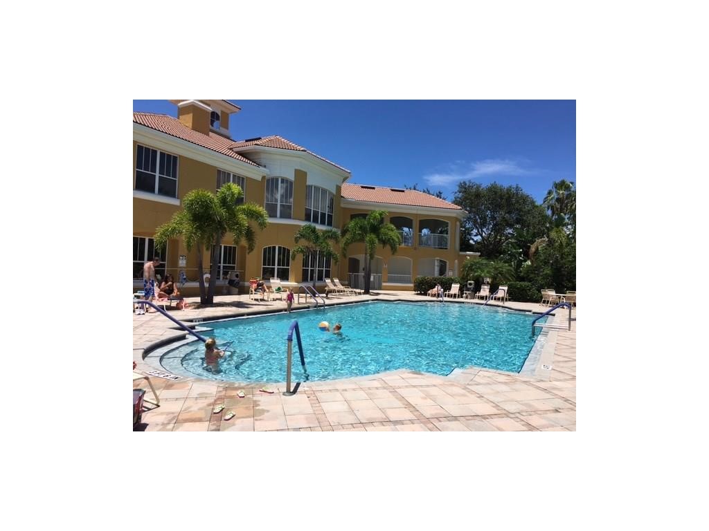 5060 Fairways Circle, Unit F207 Vero Beach, FL 32967 - Photo 2 of 14 a view of a house with backyard porch and patio