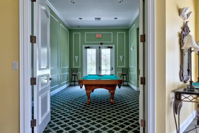 a balcony with a table and chairs