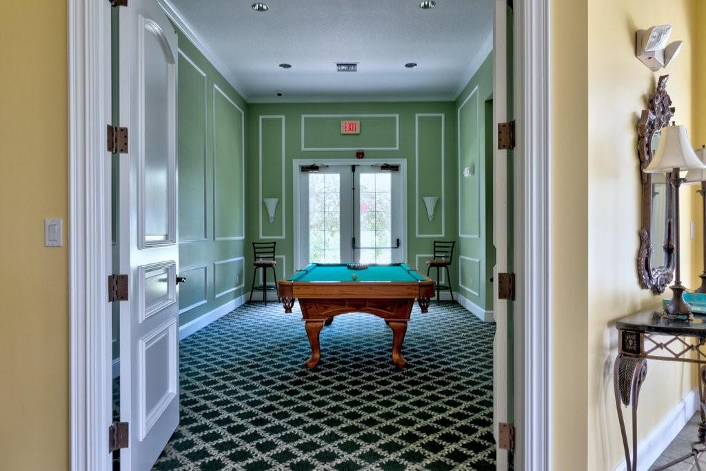 5060 Fairways Circle, Unit F207 Vero Beach, FL 32967 - Photo 3 of 14 a balcony with a table and chairs