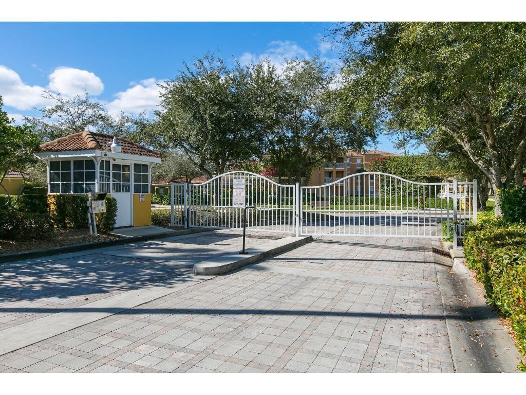 5060 Fairways Circle, Unit F207 Vero Beach, FL 32967 - Photo 4 of 14 a view of a house with a yard