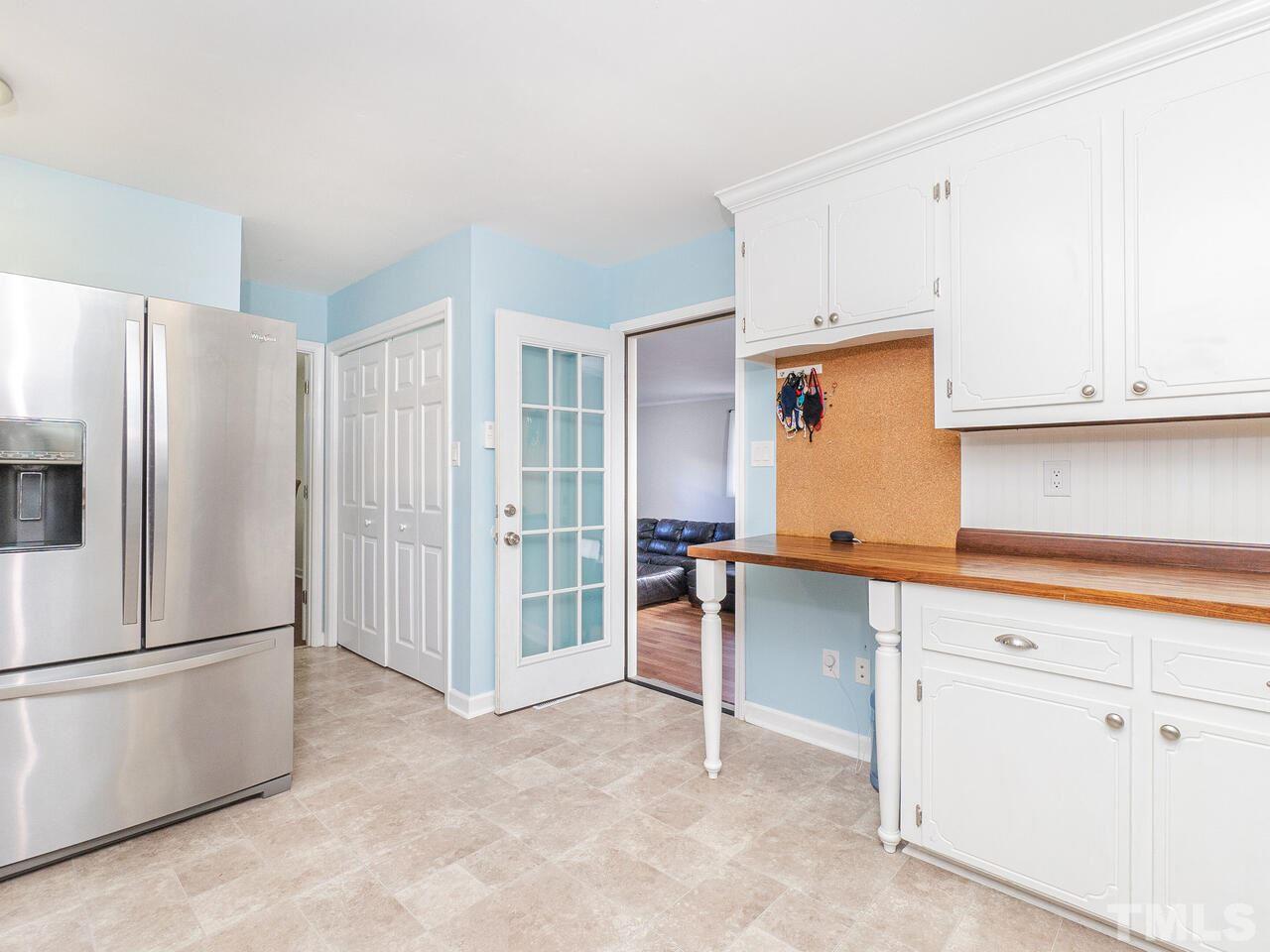 4313 Hopson Drive Raleigh, NC 27604 - Photo 12 of 30 a kitchen with stainless steel appliances a refrigerator and cabinets