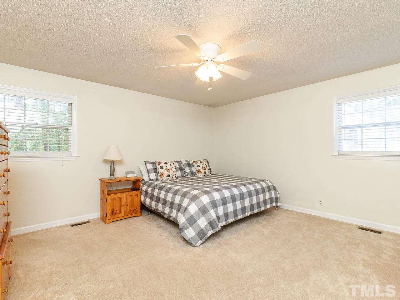 4313 Hopson Drive Raleigh, NC 27604 - Photo 19 of 30 a room with a bed and window