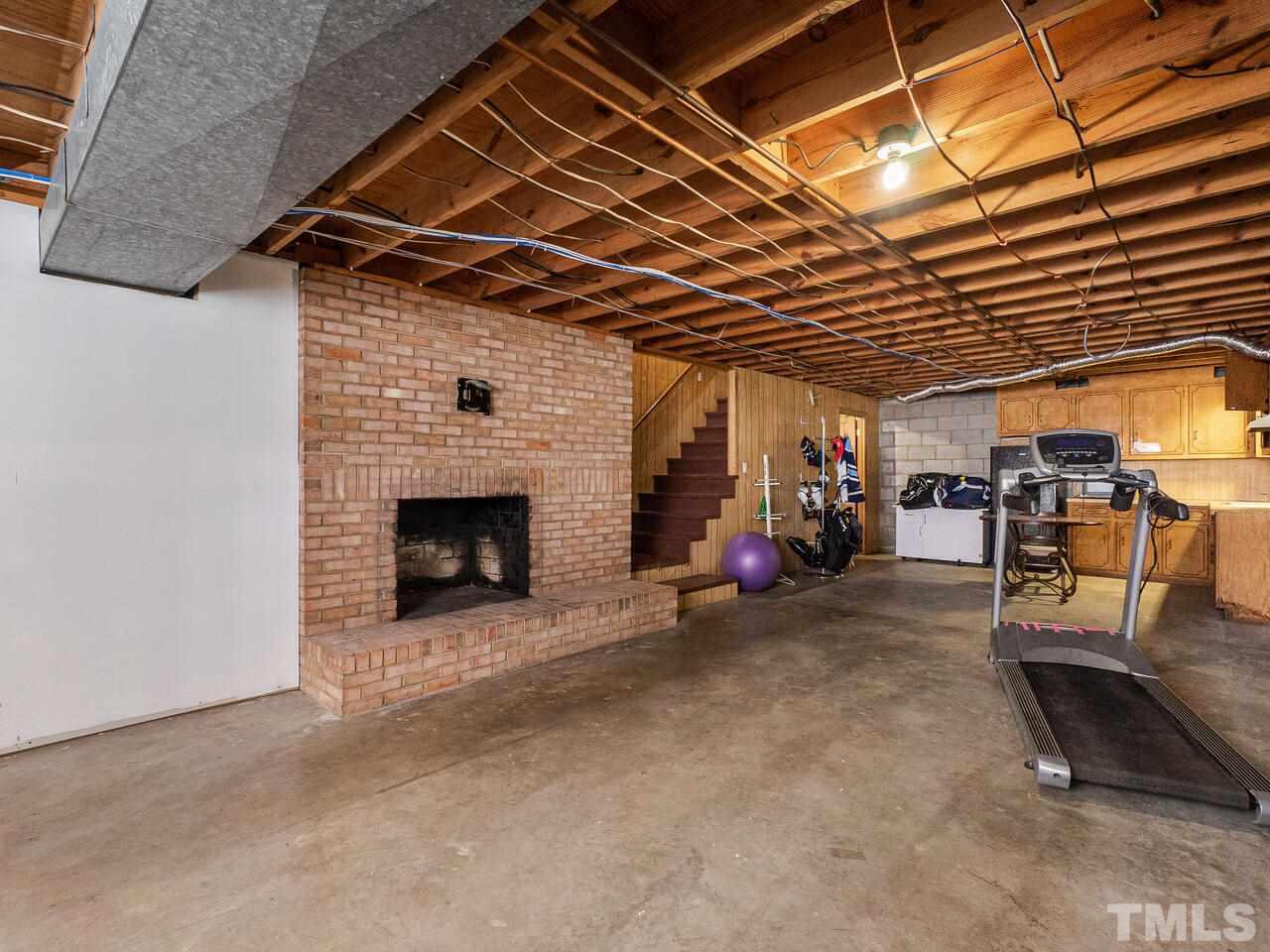 4313 Hopson Drive Raleigh, NC 27604 - Photo 26 of 30 a view of a garage with wooden floor