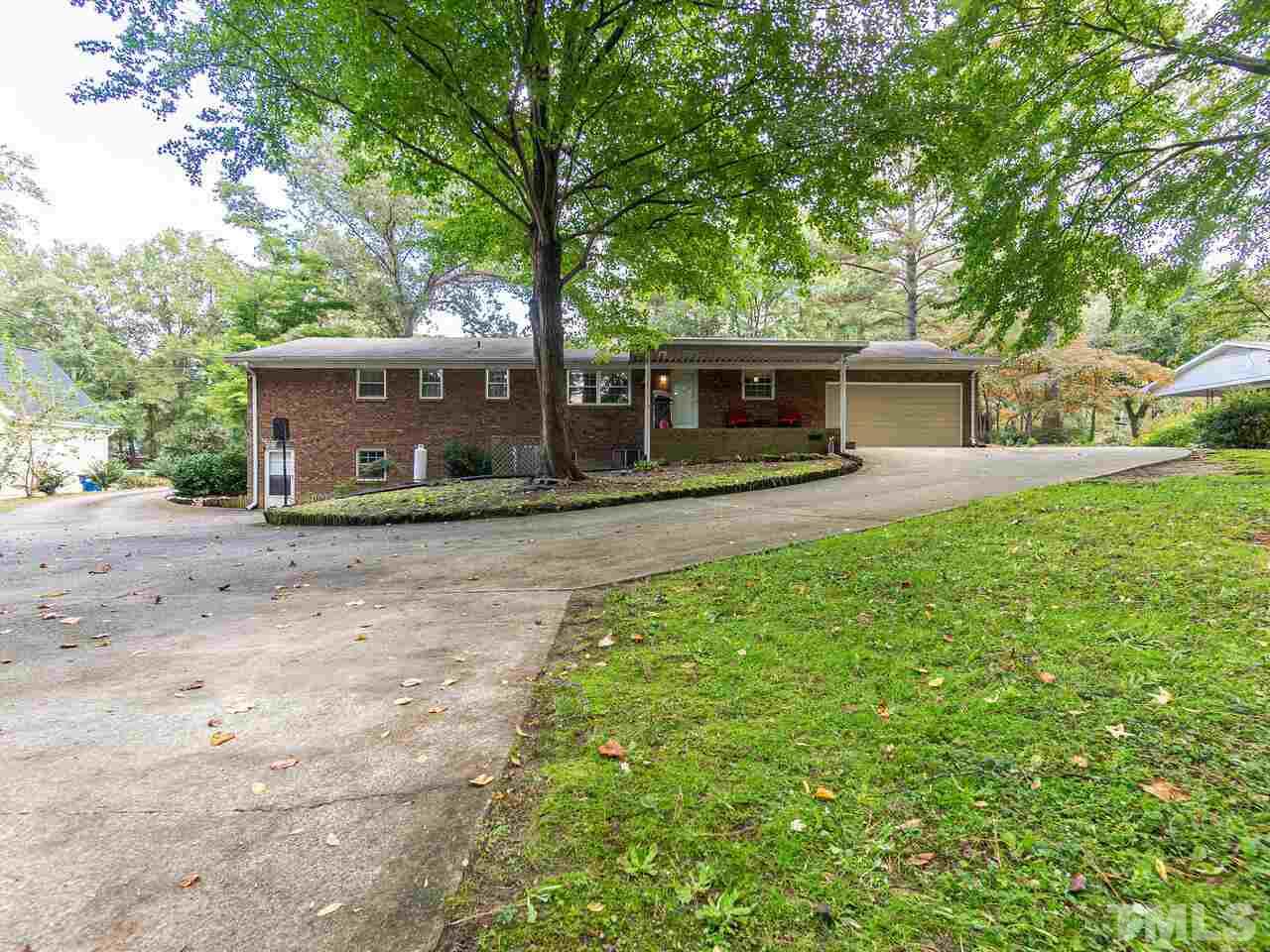 4313 Hopson Drive Raleigh, NC 27604 - Photo 29 of 30 front view of a house with a yard