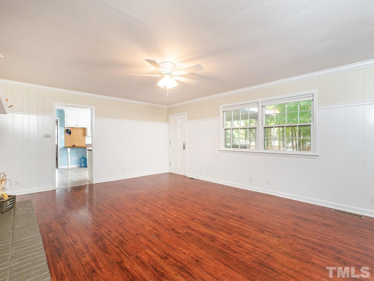 4313 Hopson Drive Raleigh, NC 27604 - Photo 8 of 30 wooden floor in an empty room with a window