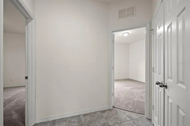 a white toilet sitting next to a bath tub
