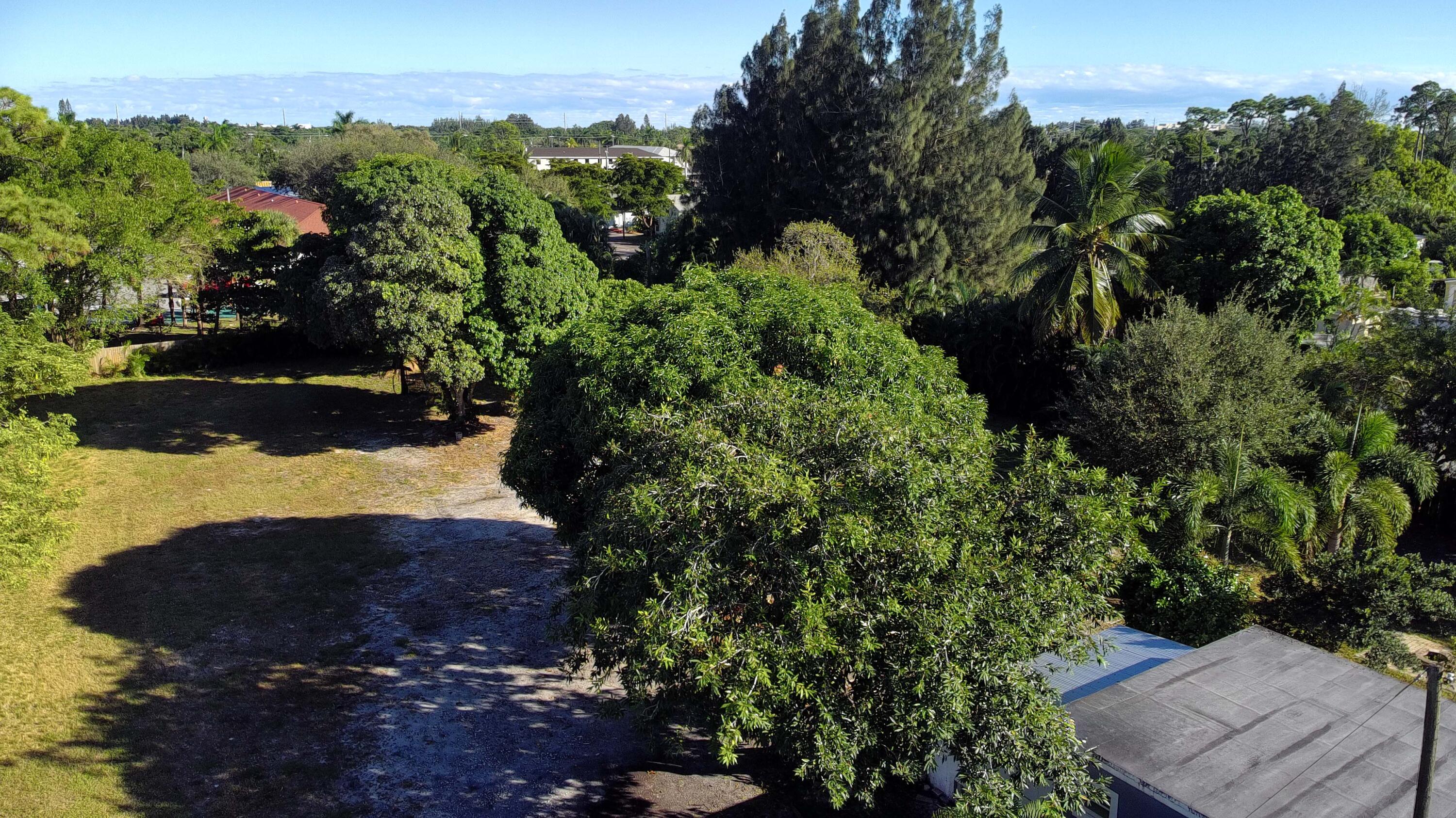 4138 Kirk Road Lake Worth, FL 33461 - Photo 4 of 9 an aerial view of a house with a yard