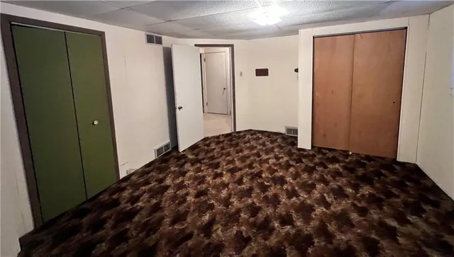 an empty room with fan