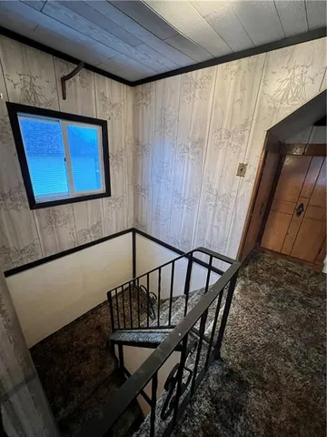 a view of an empty room with a fireplace