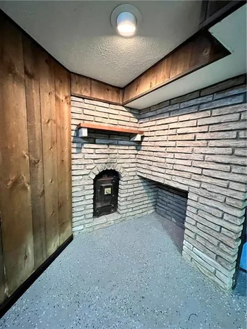 a view of a garage with parked cars