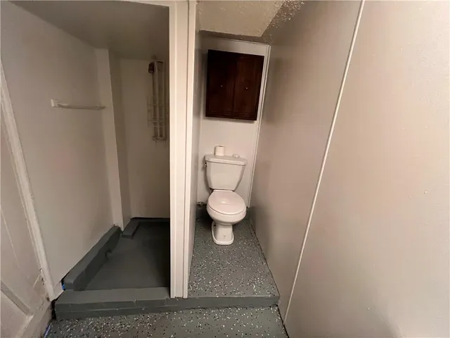 a kitchen with stainless steel appliances granite countertop a sink a stove and a refrigerator