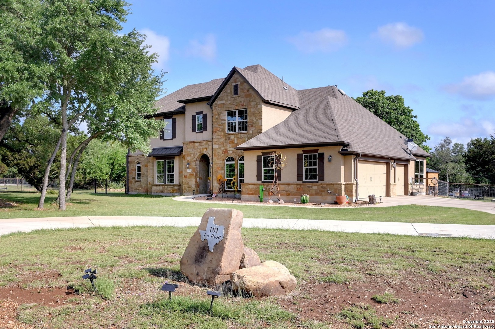 a front view of a house with a yard and swimming pool