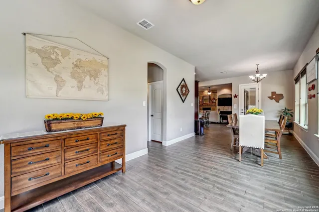 a view of a livingroom with furniture and wooden floor