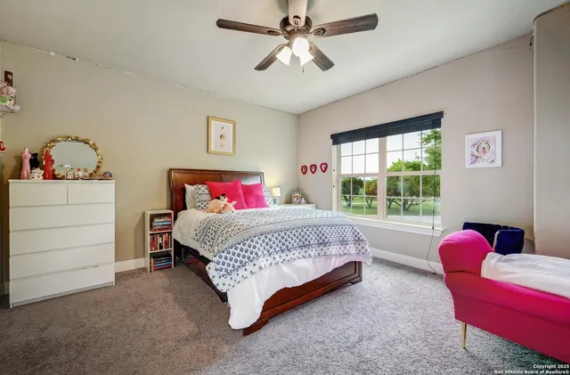 a bedroom with a bed and furniture