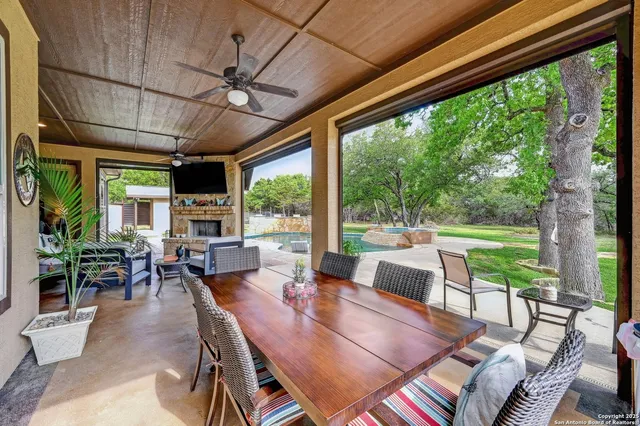 a outdoor space with lots of furniture and glass windows