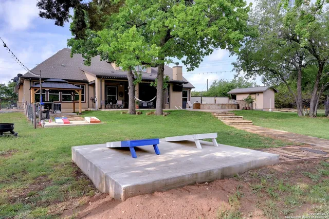 a view of a house with a yard porch and sitting area