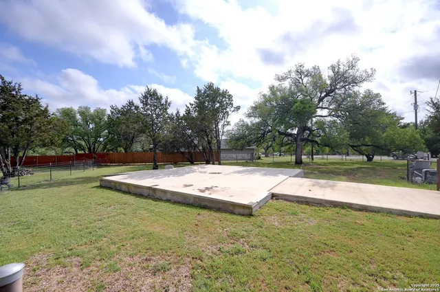 a view of a playground with trees