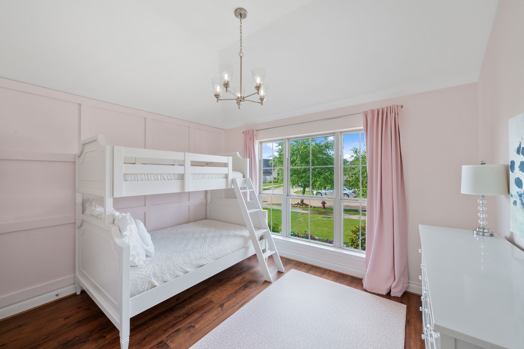 2119 Blackhawk Ridge Lane Manvel, TX 77578 - Photo 22 of 49 Charming secondary bedroom featuring accent wall in soft blush, and a large window flooding the room with natural light
