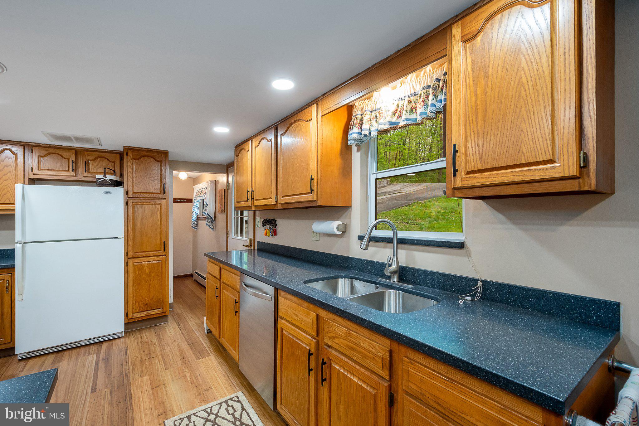 750 Lake Side Road Addison, PA 15411 - Photo 27 of 51 Warm wood tones in a cozy kitchen.