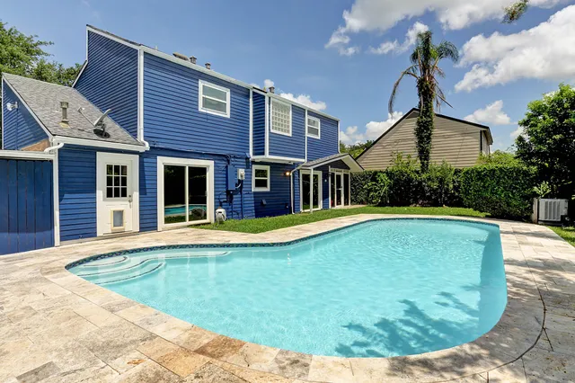 a view of a house with swimming pool