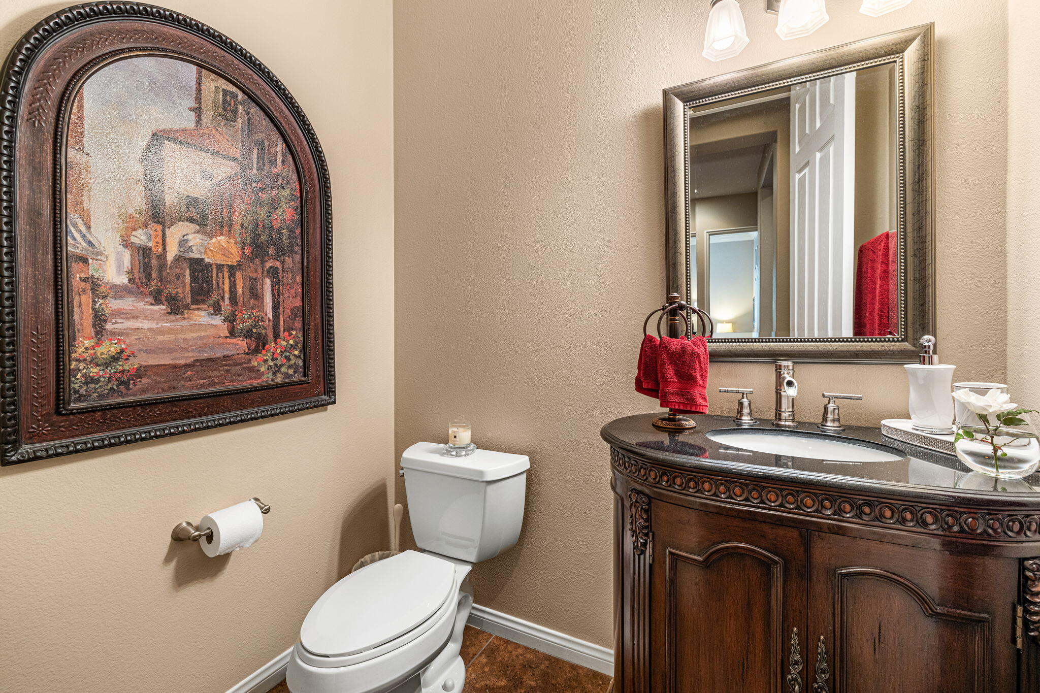 49722 Jordan Street Indio, CA 92201 - Photo 11 of 38 a bathroom with a toilet sink and mirror