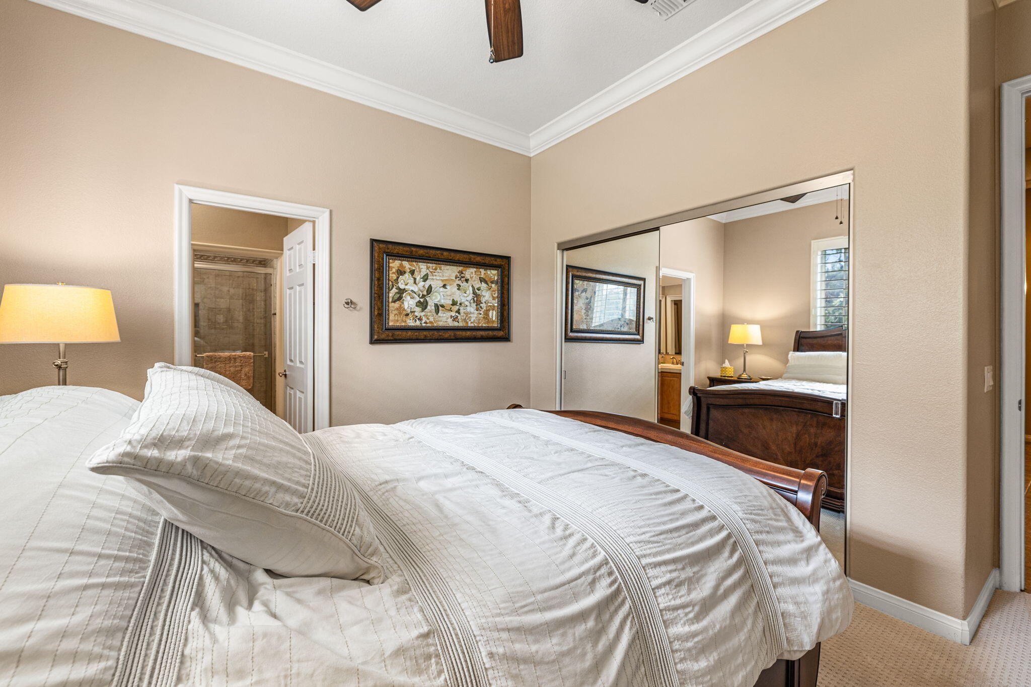 49722 Jordan Street Indio, CA 92201 - Photo 15 of 38 a bedroom with a bed and a mirror