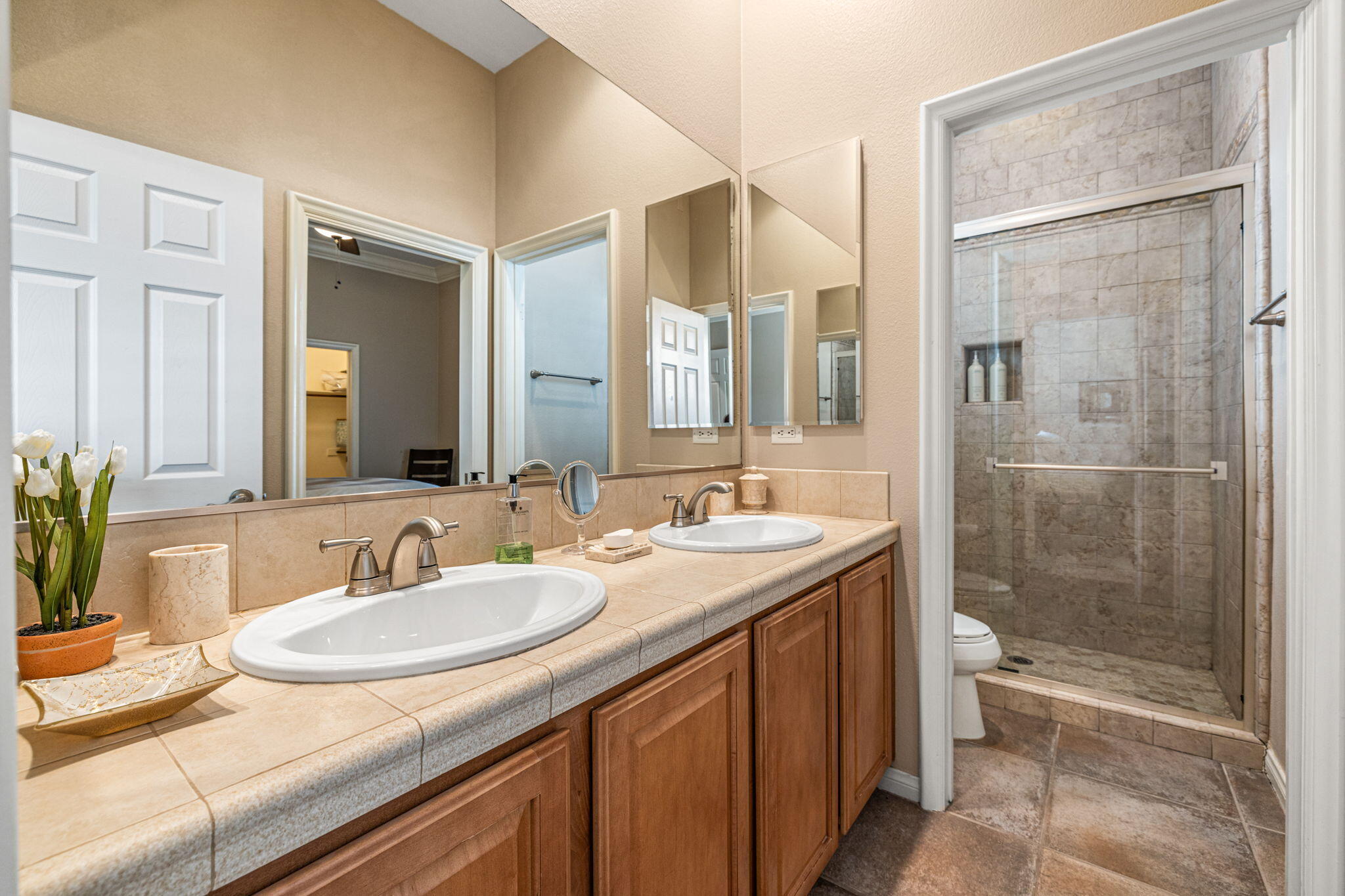 49722 Jordan Street Indio, CA 92201 - Photo 17 of 38 a bathroom with a granite countertop sink and a mirror