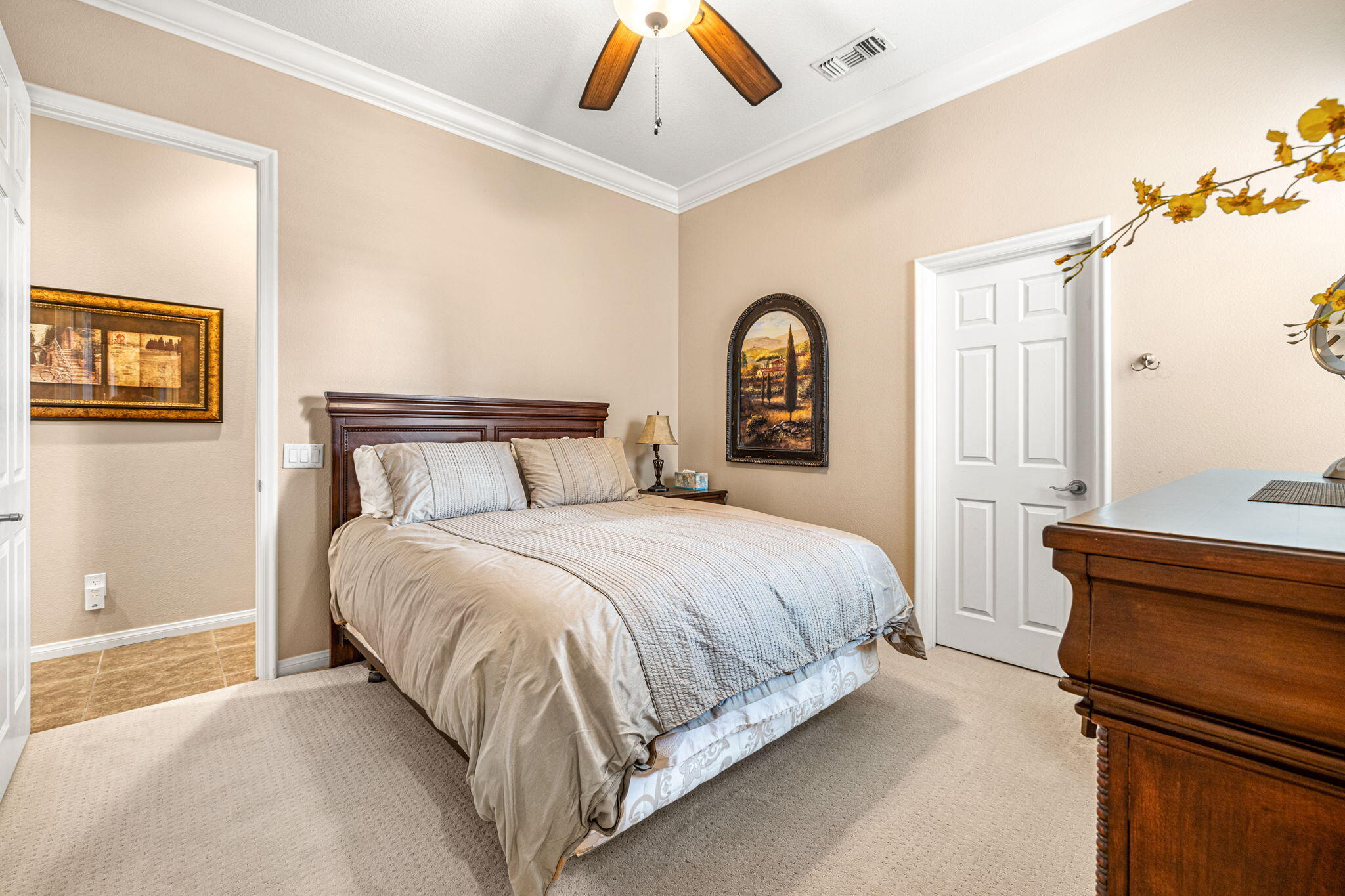 49722 Jordan Street Indio, CA 92201 - Photo 18 of 38 a bedroom with a bed and a chandelier