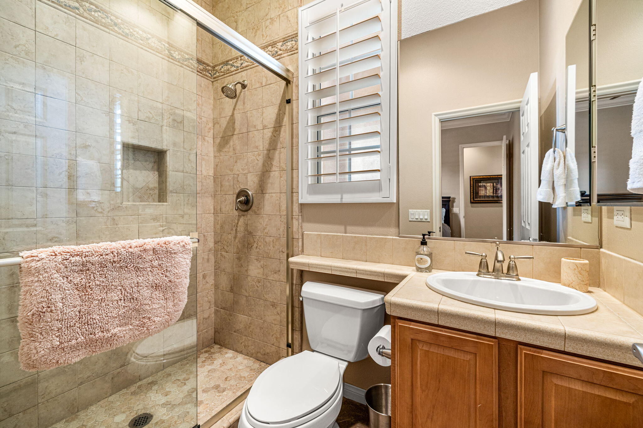 49722 Jordan Street Indio, CA 92201 - Photo 19 of 38 a bathroom with a sink toilet and shower