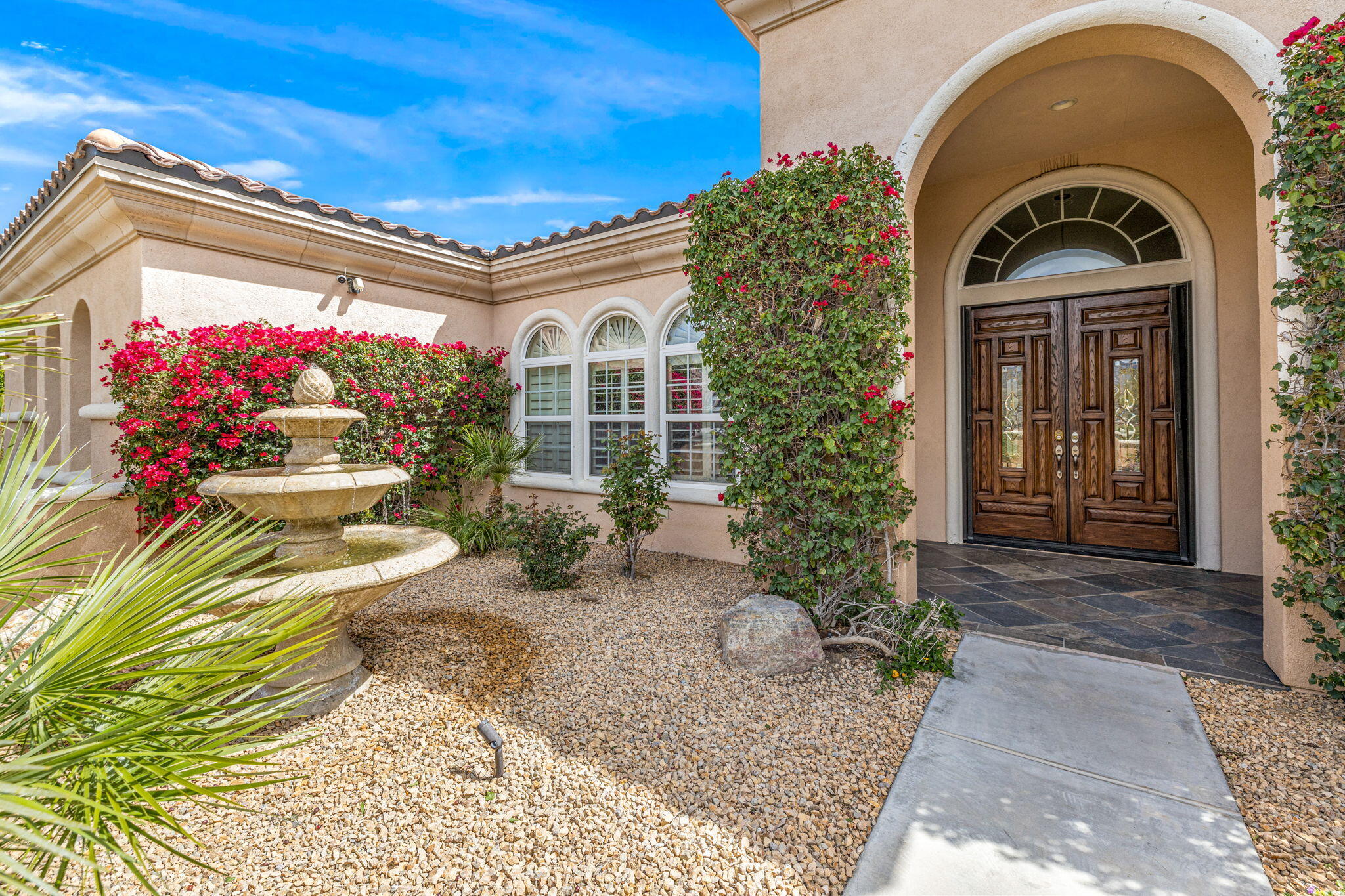 49722 Jordan Street Indio, CA 92201 - Photo 3 of 38 a front view of a house with a porch