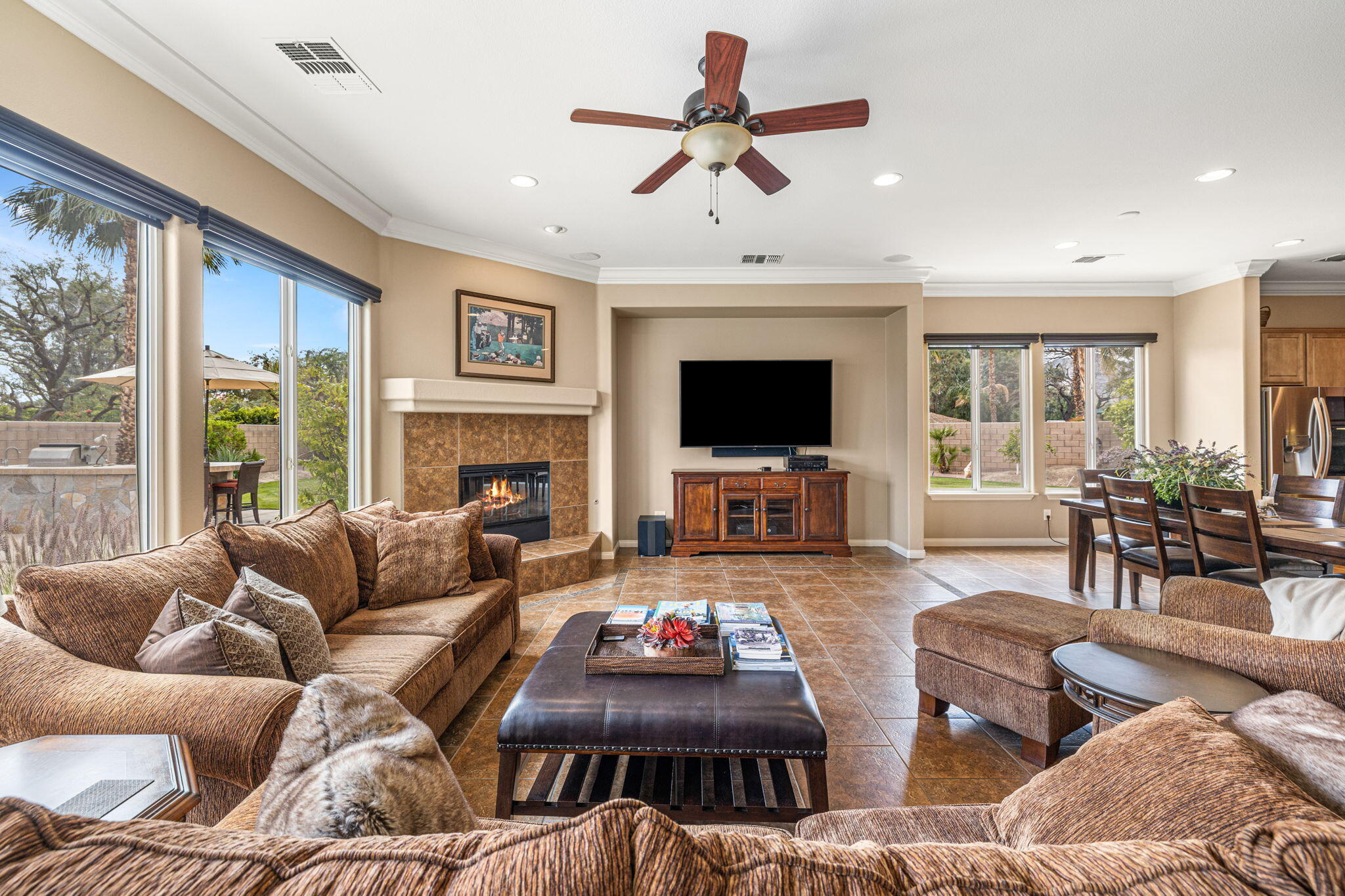 49722 Jordan Street Indio, CA 92201 - Photo 8 of 38 a living room with furniture flat screen tv and a fireplace