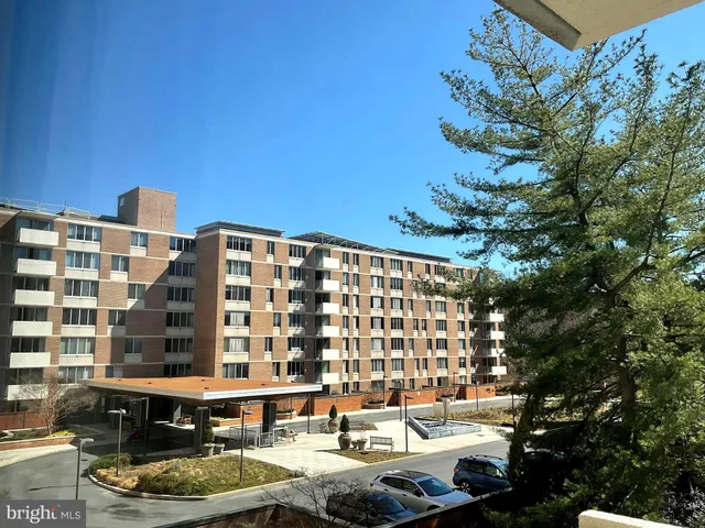 a front view of a building with street view