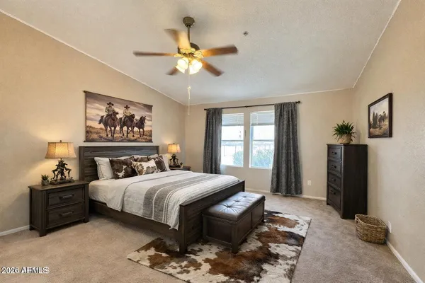 a kitchen with stainless steel appliances granite countertop a refrigerator a stove and a wooden floors