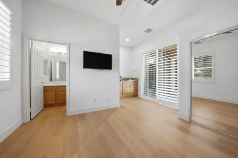 a view of a livingroom with furniture and a flat screen tv