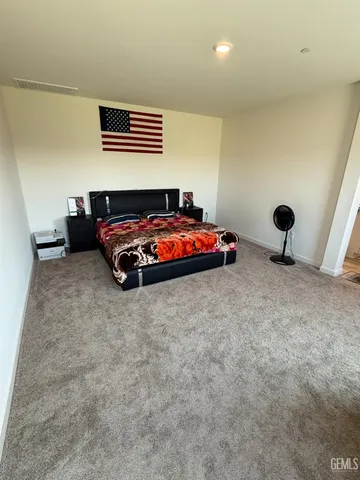 a bedroom with furniture and window