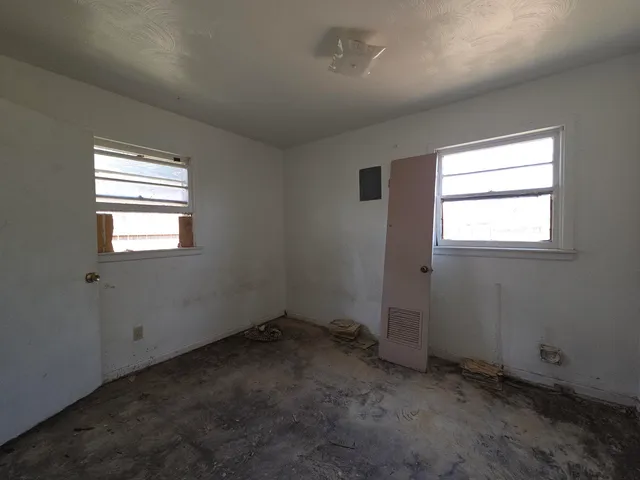 an empty room with windows