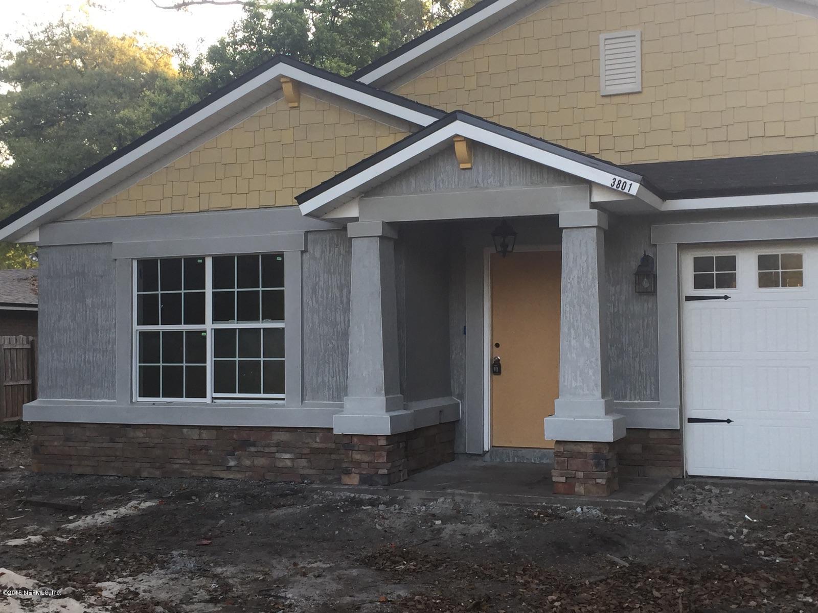 3801 Spring Glen Road Jacksonville, FL 32216 - Photo 2 of 4 a front view of a house with a yard