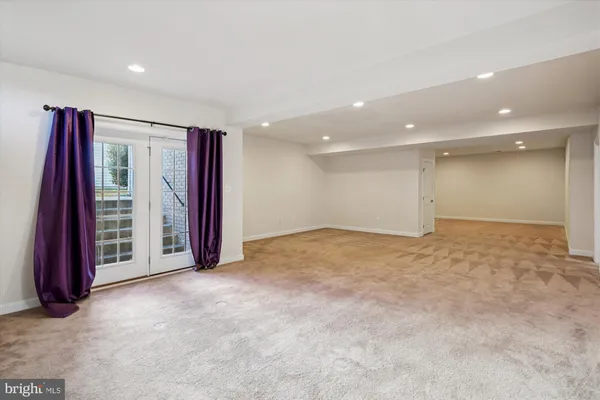 a view of an empty room with a fireplace