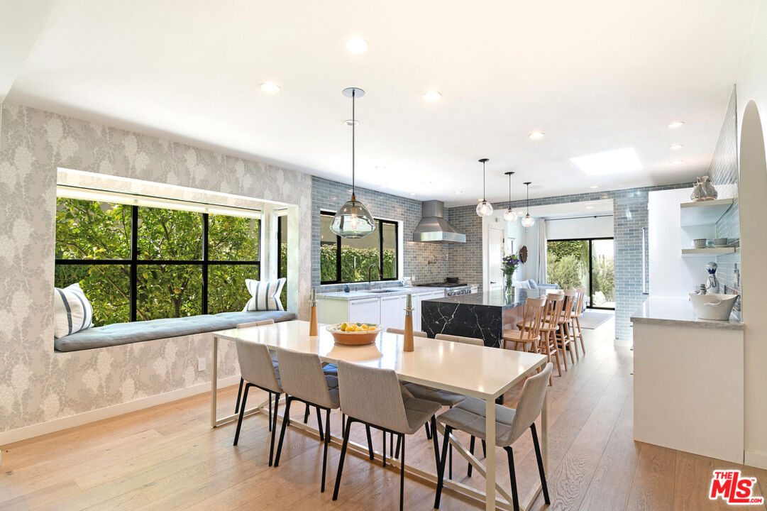 743 North June Street Los Angeles, CA 90038 - Photo 12 of 38 a view of a dining room with furniture window and outside view