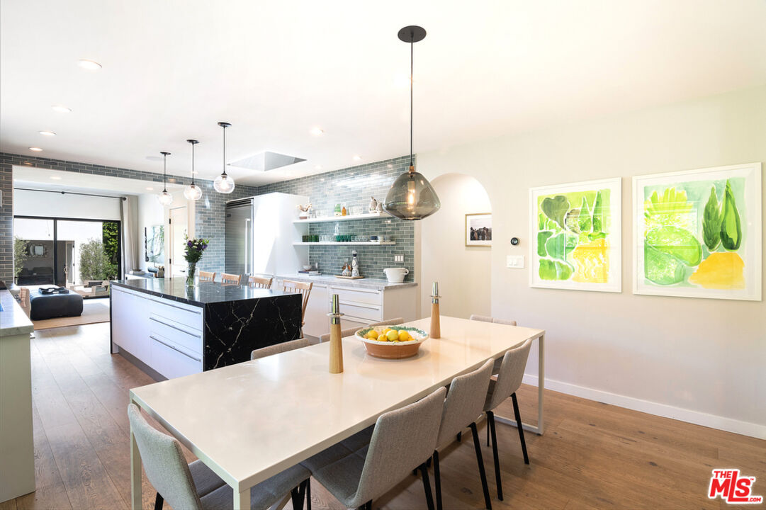 743 North June Street Los Angeles, CA 90038 - Photo 13 of 38 a large kitchen with a table and chairs
