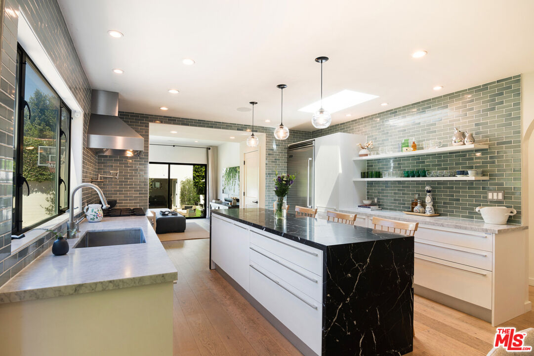 743 North June Street Los Angeles, CA 90038 - Photo 15 of 38 a large kitchen with kitchen island a large window